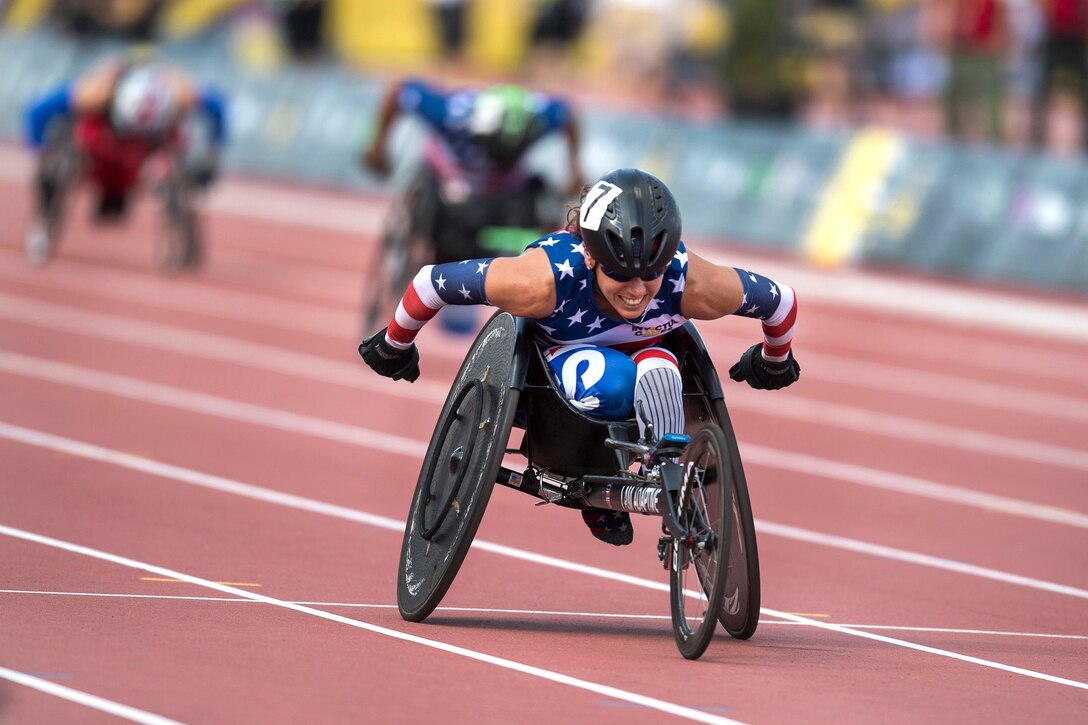 An Army veterans races a wheelchair.
