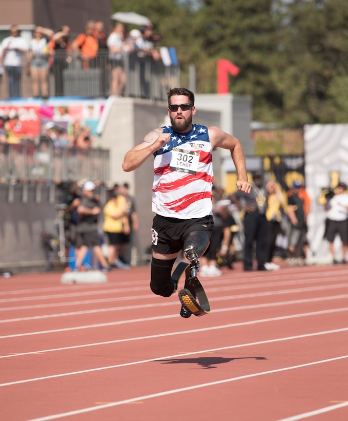 An Army veteran sprints in a race.