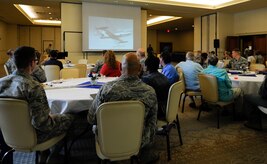 Members of Joint Base Charleston watch a video honoring the U.S. Air Force’s 70th Anniversary at the Charleston Club, Sept. 22, 2017.
