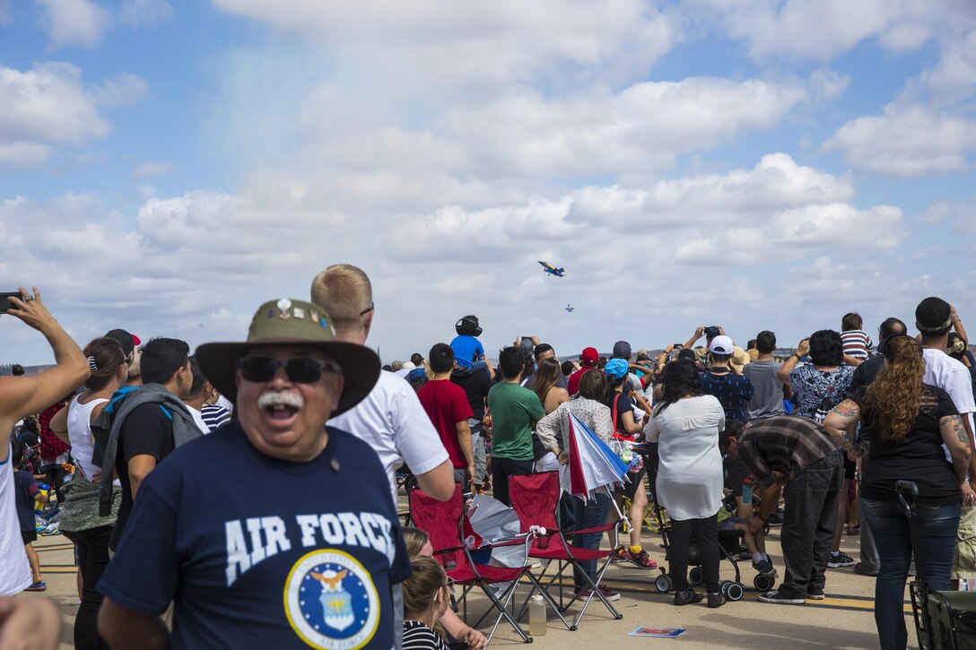 The U.S. Navy Blue Angels perform above crowds at the 2017 Marine Corps Air Station Miramar Air Show at MCAS Miramar, Calif., Sept. 23. The theme for the air show is “A Salute to Vietnam Veterans” and featured several performances and displays to recognizing the sacrifices of Vietnam veterans. “The 2017 MCAS Miramar Air Show gives the public and current service members an opportunity to say thank you to the veterans of the Vietnam War,” said Col. Jason Woodworth, commanding officer of MCAS Miramar. “Our goal is to remind the veterans that the country cares about them and truly values the sacrifice they made for the American people, regardless of how they were treated when they initially returned from Vietnam.”  (U.S. Marine Corps photo by Sgt. Lillian Stephens/Released)