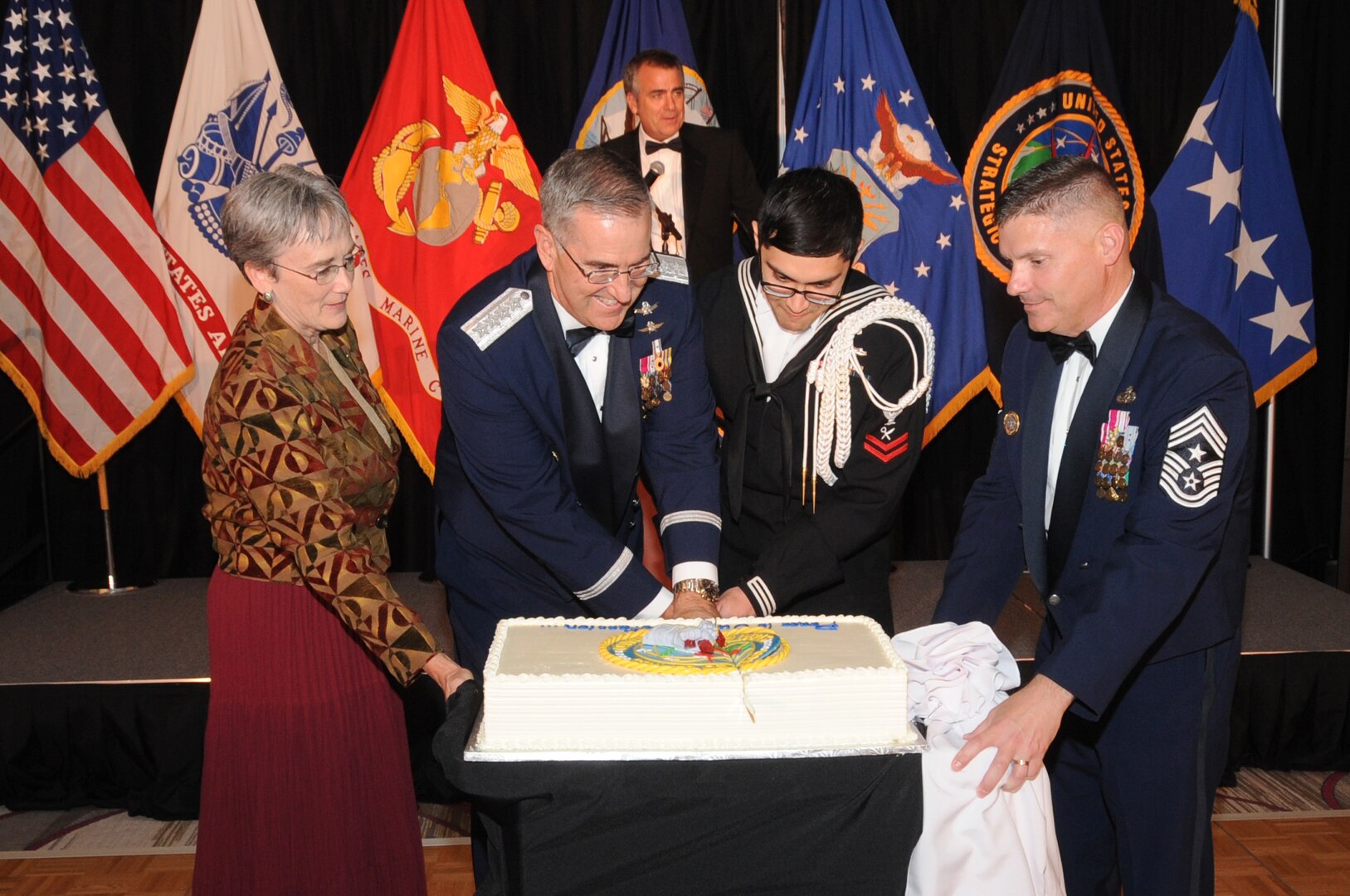 Cutting the cake during the U.S. Strategic Command (USSTRATCOM) Birthday Ball in Bellevue, Neb., Sept. 22, 2017 are, from left to right, Secretary of the Air Force Heather Wilson; U.S. Air Force Gen. John Hyten, commander of USSTRATCOM; Petty Officer 2nd Class Jose Mendoza, targeting analyst for Joint Functional Component Command for Global Strike; and Chief Master Sgt. Patrick F. McMahon, USSTRATCOM senior enlisted leader. The current USSTRATCOM was established Oct. 1, 2002, when USSTRATCOM merged with U.S. Space Command, and also gained responsibility for missile defense and cyberspace operations. One of nine Department of Defense unified combatant commands, USSTRATCOM has global missions assigned through the Unified Command Plan that include strategic deterrence, space operations, cyberspace operations, joint electronic warfare, global strike, missile defense and intelligence.