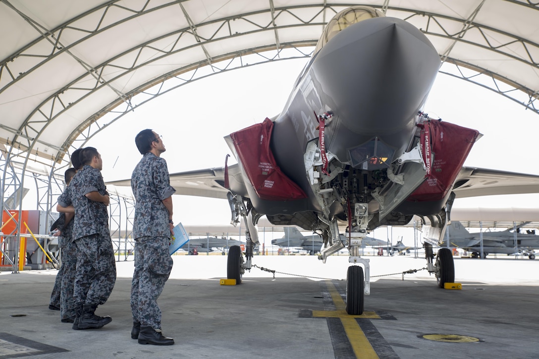Japan Air Self-Defense Force personnel study the F-35B Lightning II during an educational tour and class led by Marine Fighter Attack Squadron 121 at MCAS Iwakuni, Japan, Sept. 13, 2017. Several classes were conducted for JASDF personnel regarding maintenance, serviceability, operability and more. Afterwards, they briefly toured VMFA-121’s facility, taking a peek into different departments and visiting the hangar to see, touch and study the aircraft up close. This is the first time VMFA-121 has conducted an exchange like this.