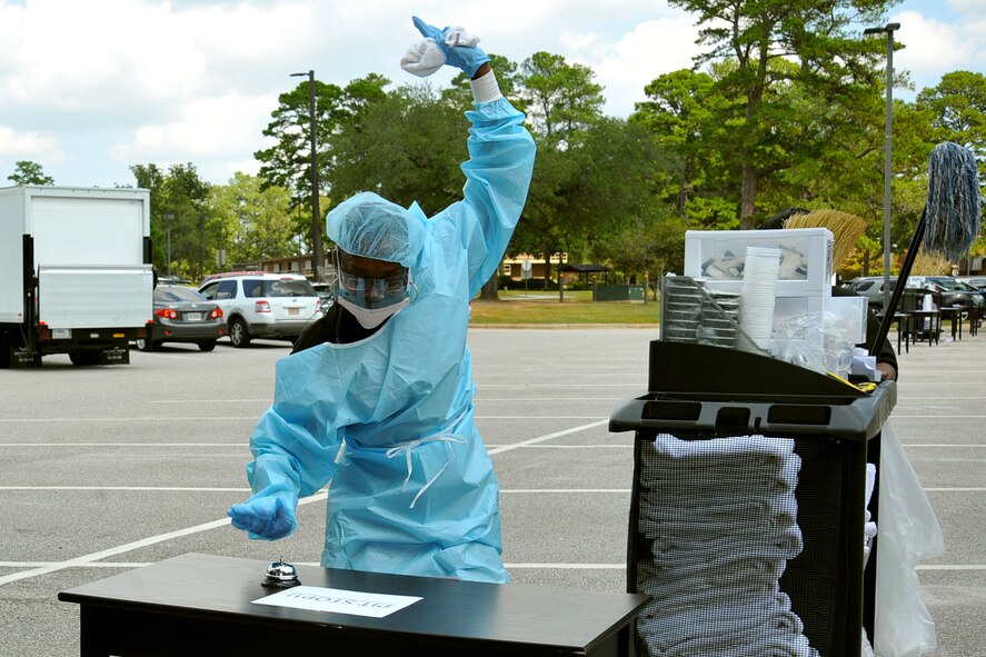 Ruth Holliday, 20th Force Support Squadron Carolina Pines Inn custodial worker, rings a bell to win the Amazing Housekeeper Race for her team at Shaw Air Force Base, S.C., Sept. 22, 2017. The race was part of a celebration for International Housekeeping Week 2017, a week honoring housekeepers for their work keeping facilities clean and hospitable.  (U.S. Air Force photo by Airman 1st Class Kathryn R.C. Reaves)