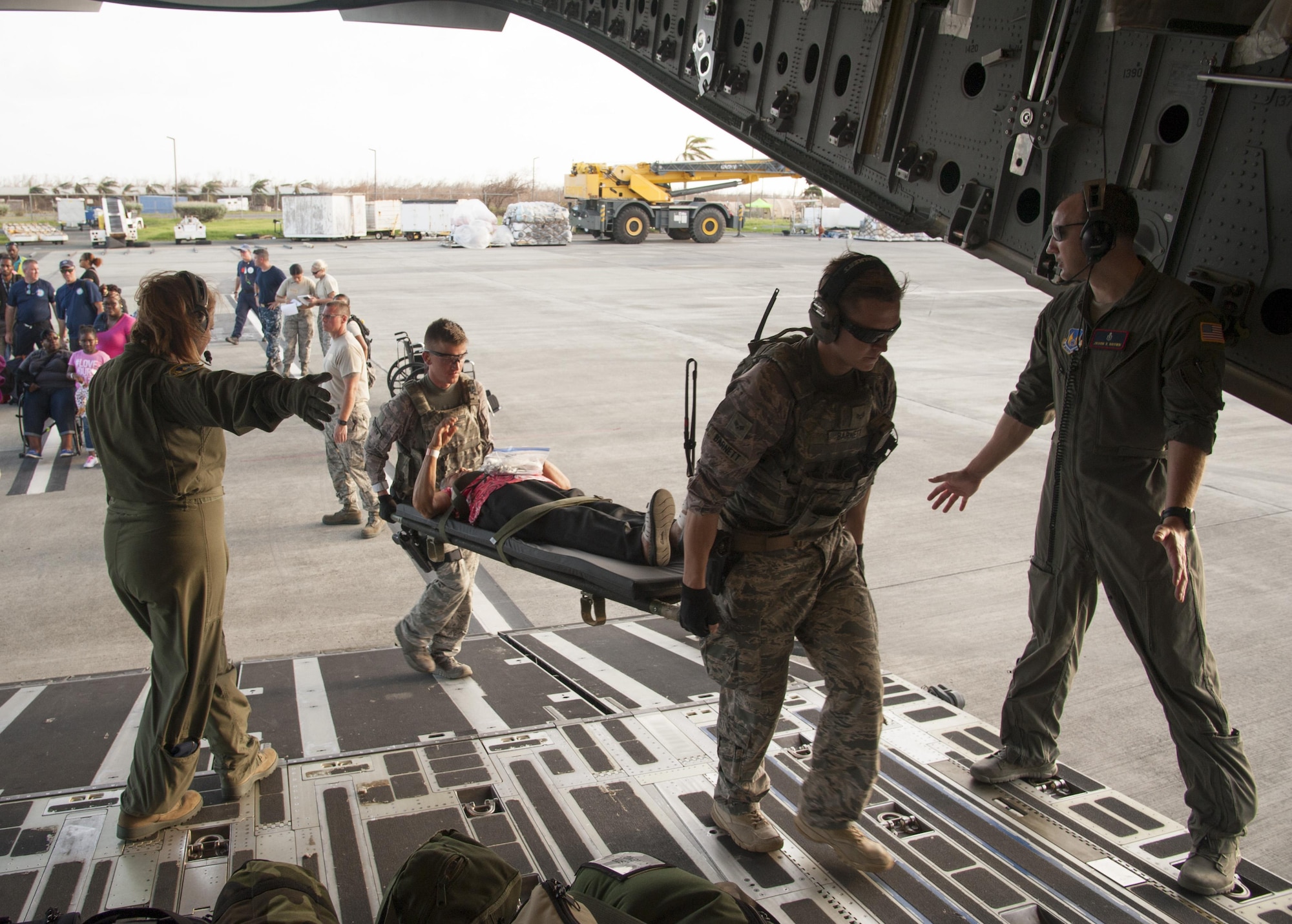 Reserve Citizen Airmen assigned to the 45th Aeromedical Evacuation Squadron, carry patients aboard a C-17 Globemaster III in St. Croix, U.S. Virgin Islands, Sept. 24, 2017. Reserve Citizen Airmen conducted humanitarian mission to St. Croix to evacuate victims affected by Hurricane Maria. (U.S. Air Force photo by Tech. Sgt. Peter Dean)
