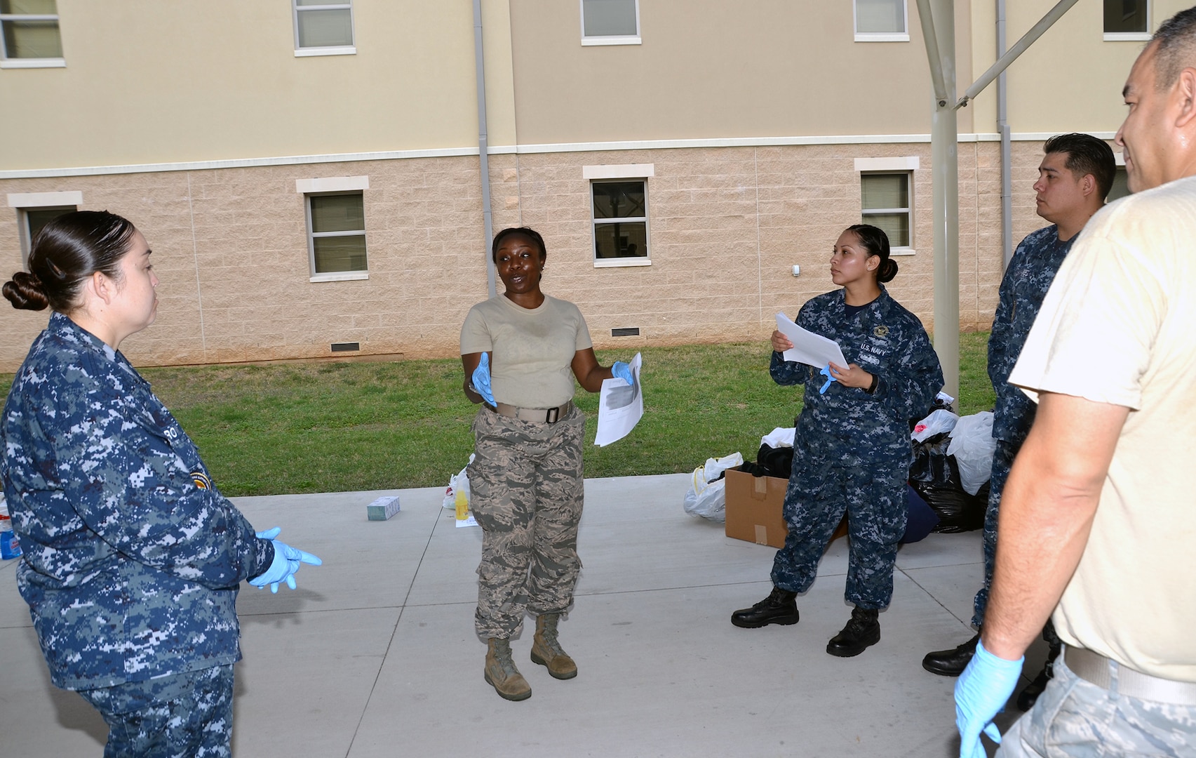 1st Lt. Ebony Shannon (center), Medical Education and Training Campus Support Center Information Technology Director, organizes volunteer efforts to sort through bags and boxes of donations collected for victims of Hurricane Harvey Sept. 19. In all, the team collected and donated 450 pounds of food to the San Antonio Food Bank, $3,300 in donated diapers to the Diaper Bank, $19,000 in clothing and incidentals to the Salvation Army, and numerous donations to the American Society for the Prevention of Cruelty to Animals and homeless shelters.
