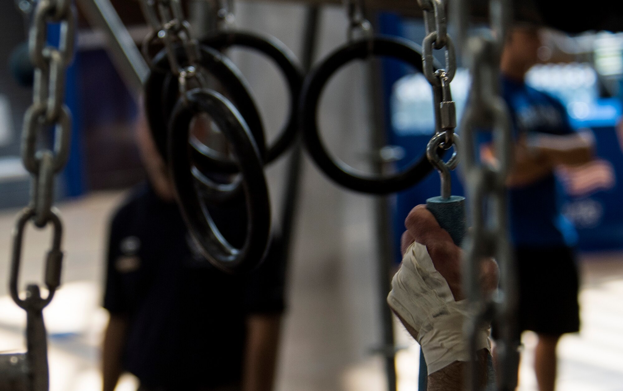 A contestant grips a cone hanging from a chain to swing to the other side of the Alpha Warrior’s Battle Rig obstacle course during the Alpha Warrior regional competition on Ramstein Air Base, Germany, Sept. 23, 2017. While the Alpha Warrior program is not officially incorporated into the Air Force fitness program, it provides another option for Airmen to vary their physical fitness programs and remain fit to fight. (U.S. Air Force photo by Senior Airman Tryphena Mayhugh)