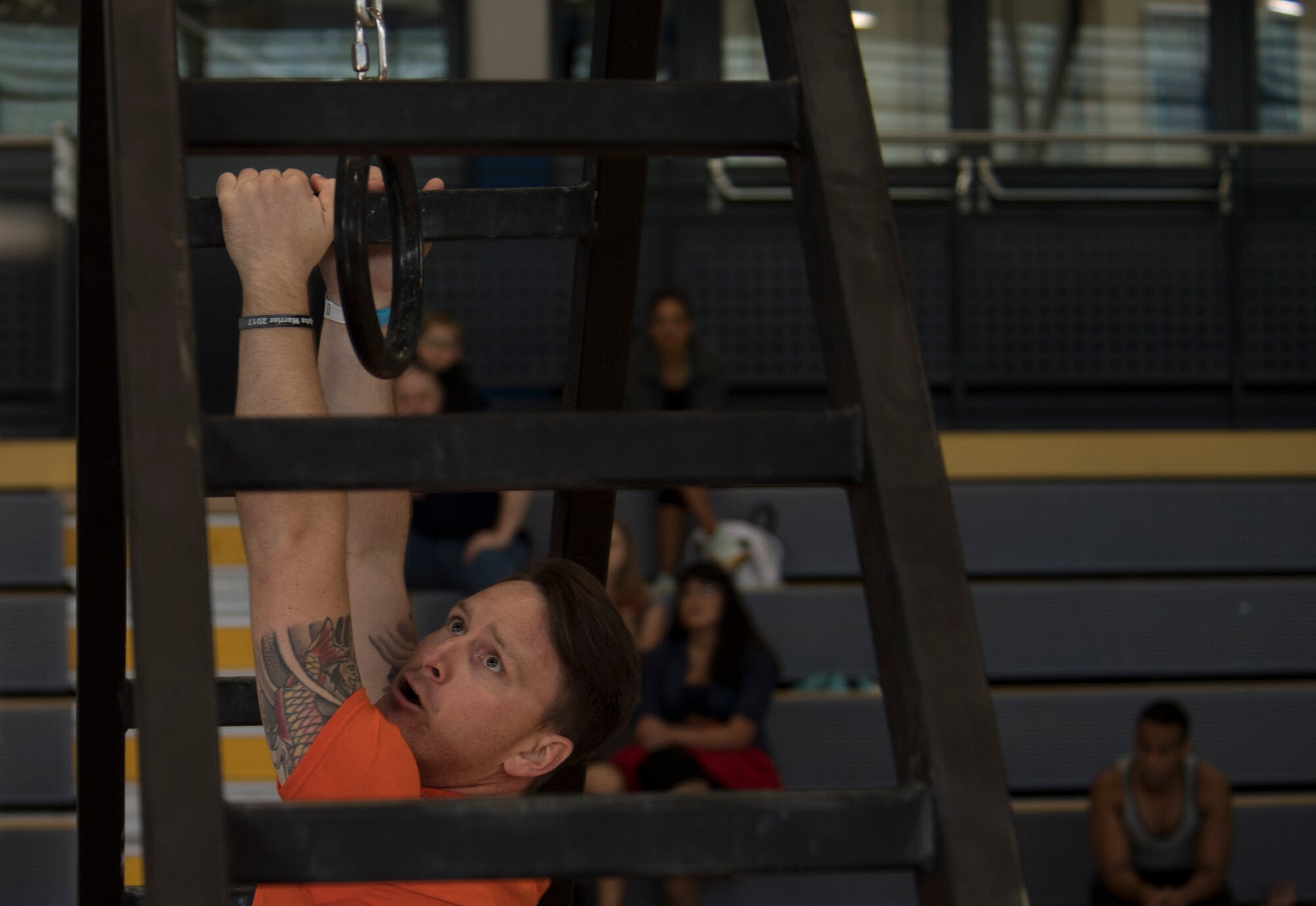 U.S. Air Force Staff Sgt. Kevin Hawkins, 31st Maintenance Squadron phase inspection section member, prepares to reach for a ring while undergoing the last section of the Alpha Warrior’s Battle Rig obstacle course during the Alpha Warrior regional competition on Ramstein Air Base, Germany, Sept. 23, 2017. The top male and female contestants from the competition will travel to San Antonio, Texas, in November 2017 for the championship. (U.S. Air Force photo by Senior Airman Tryphena Mayhugh)