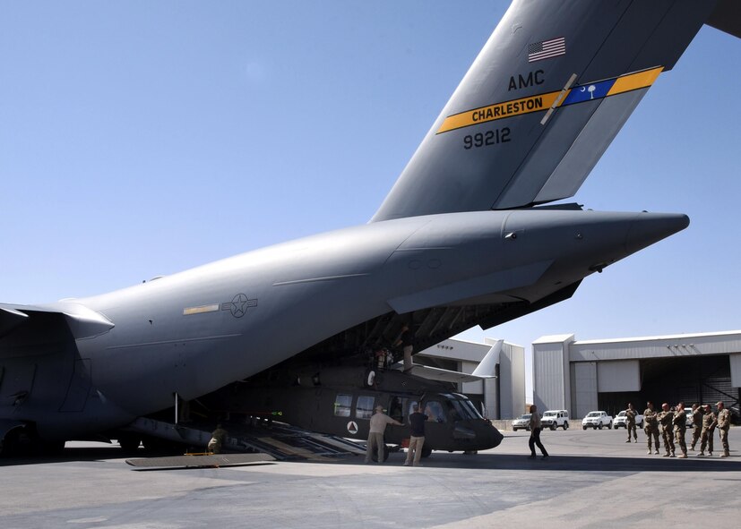 Train, Advise, Assist Command-Air advisors observe as an Afghan Air Force UH-60 is unloaded from a U.S. Air Force C-17 Globemaster, Sept. 18, 2017, at Kandahar Air Field, Afghanistan. The TAAC-Air advisors have worked closely with their Afghan counterparts to prepare for the modernization of the AAF, as the service transitions from Mi-17s to UH-60s. These are the first AAF UH-60s to arrive in country. (U.S. Air Force photo by Tech. Sgt. Veronica Pierce)