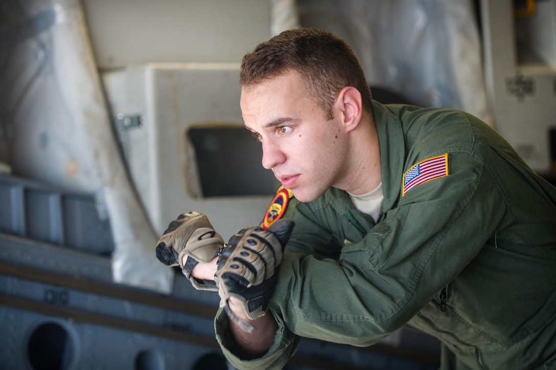 An airman gives hand signals.