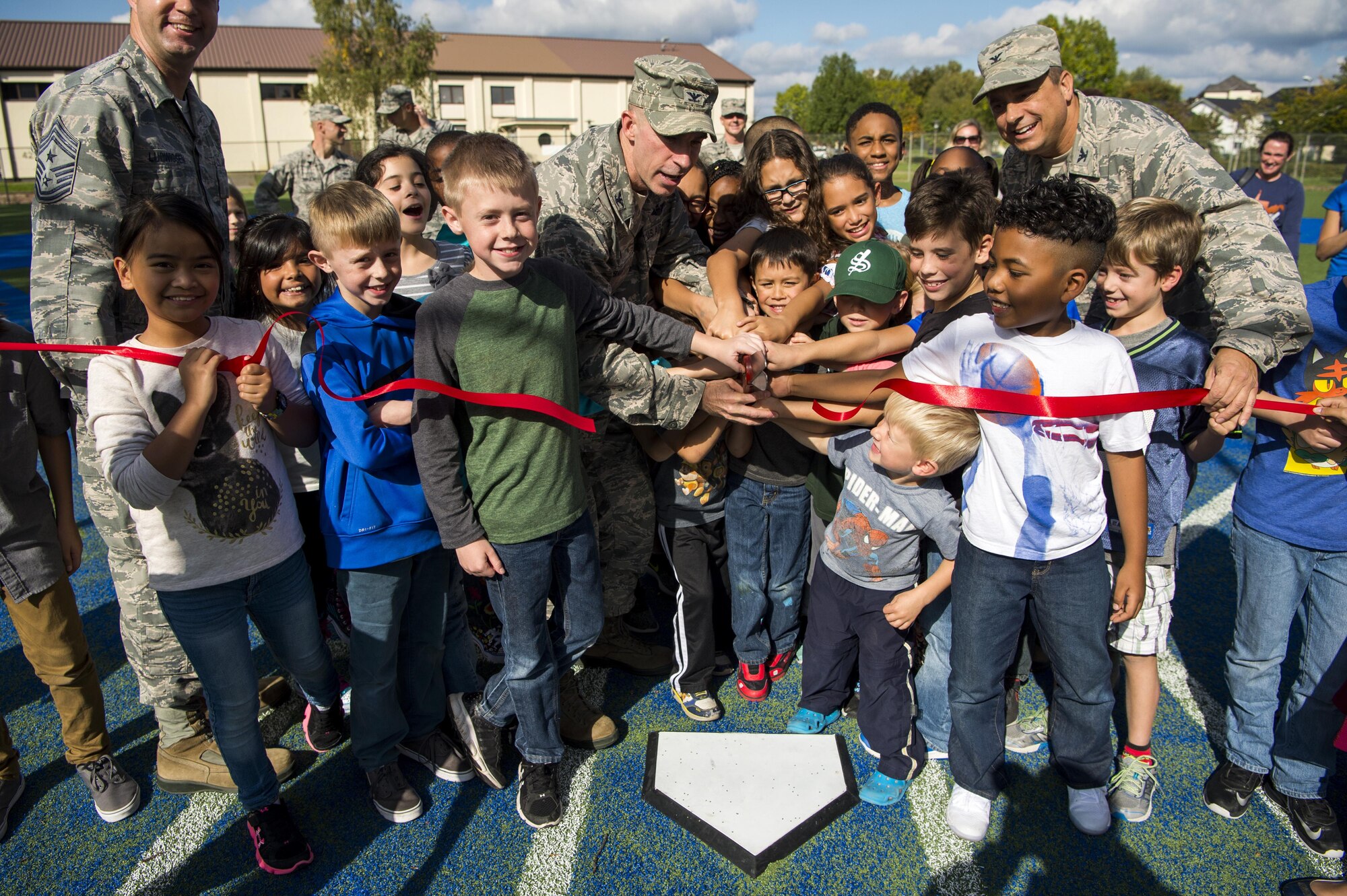 Saber Children, Leadership play ball at newly renovated Falcon Field
