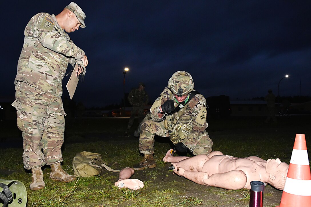 A soldier participates in medical skills tasking during the Expert Infantryman Badge competition.