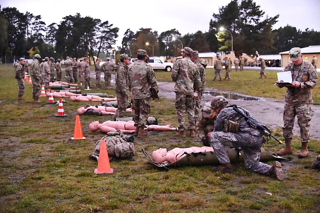 Soldiers participate in medical skills tasking during the Expert Infantryman Badge competition.