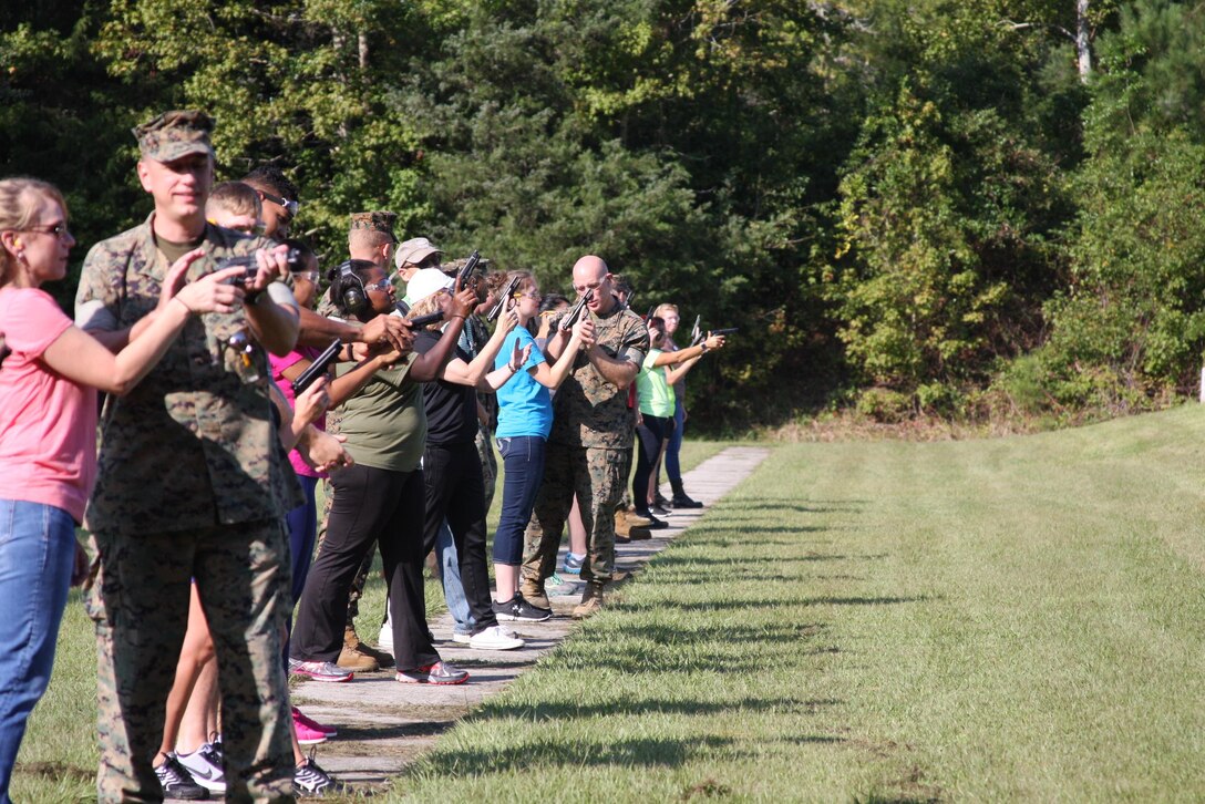 On September 22, 2017 Marine Corps Engineer School hosted a Better Half Day; the first event was a pistol range. While under the supervision of their Marine, acting as a Position Safety Officer; spouses conduct dry firing to familiarize themselves with the M9 pistol and course of fire.