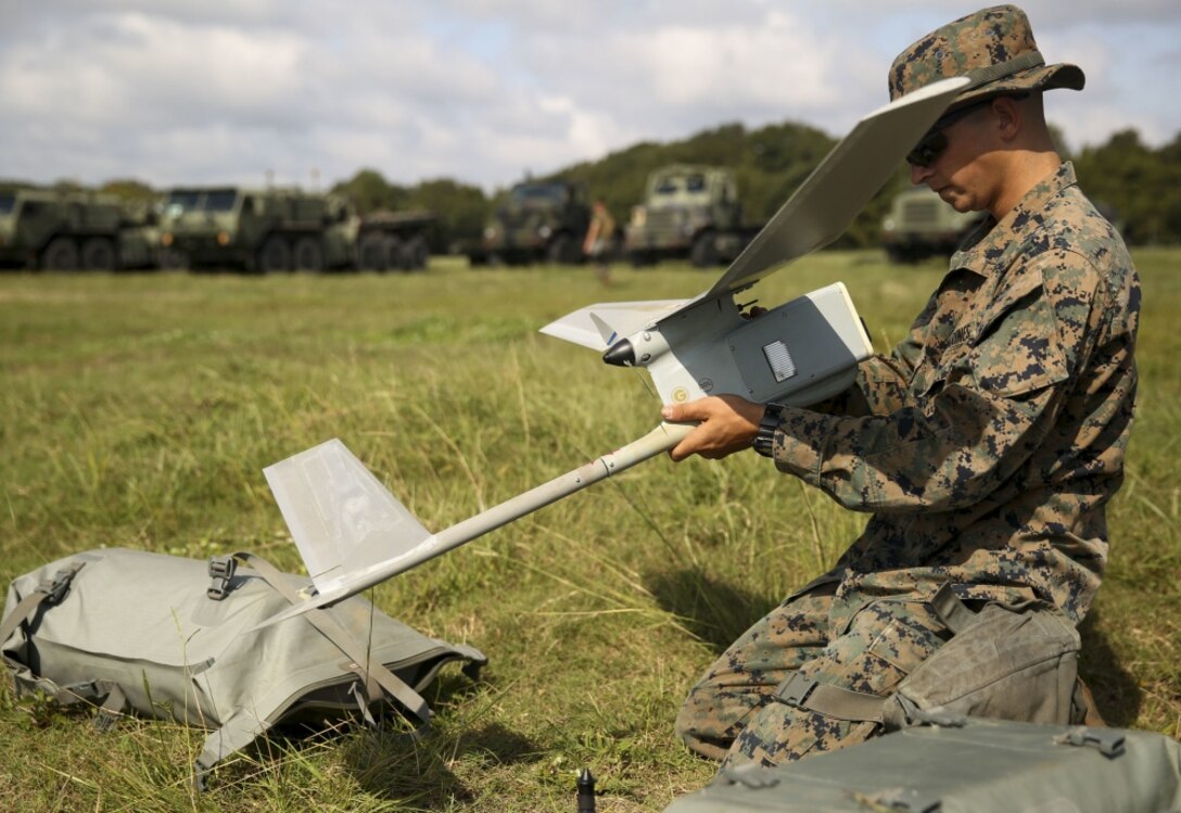 A Marine constructs an intelligence collection device used to remotely photograph areas with minimal detection during a field training exercise at Camp Lejeune, N.C., Sept. 17-21, 2017. The field exercise prepares Marines for future deployments though events including engineer reconnaissance, helicopter operations, improvised explosive device lanes with route clearing courses, survivability tasks, breeching, and urban operations. The Marines are with 2nd Combat Engineer Battalion. (U.S. Marine Corps photo by Lance Cpl. Gloria Lepko)