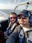 David Simons, right, U.S. Army Europe Office of the Deputy Chief of Staff engineer, pilots an aircraft with his daughter, Ava.