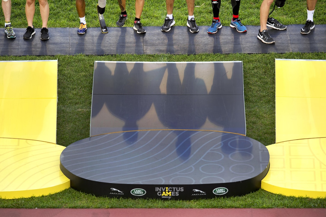 Athletes line up before a ceremony to receive medals during the finals of track and field.