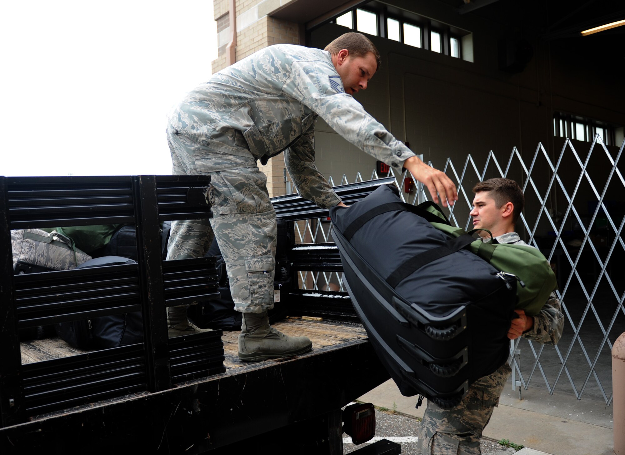 An Airman examines baggage content