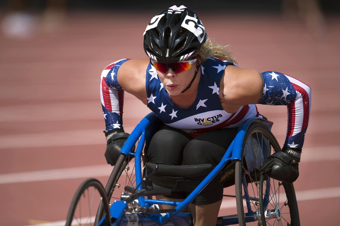 Army Sgt. Brandi Evans competes in a wheelchair race during the finals of track and field part of the Invictus Games 2017.