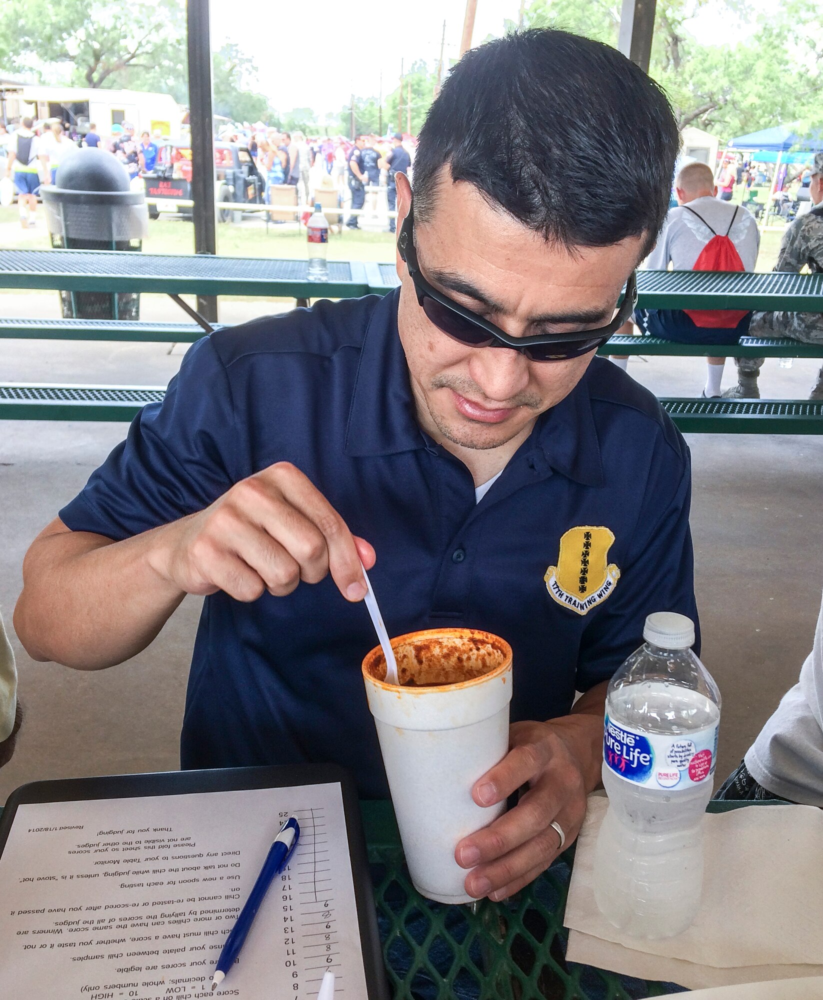 U.S. Air Force Col. Ricky Mills, 17th Training Wing commander, judges food for the 44th Annual Armed Forces Chili Cook-Off during the Ruckus at the Rec Camp at the Goodfellow Air Force Base Recreation Camp, San Angelo, Texas, Sept. 23, 2017. The competition included categories for teams and individuals in the Terlingua, chicken, ribs, beans or the "anything goes" category. (U.S. Air Force photo by Aryn Lockhart/Released)
