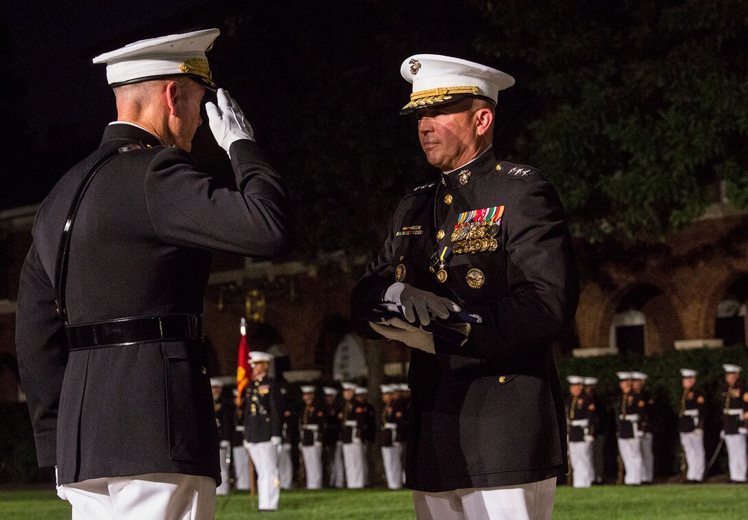 General Joseph F. Dunford, 16th Chairman of the Joint Chiefs of Staff, renders a salute to the National Ensign during a retirement ceremony for Lt. Gen. John E. Wissler, outgoing commander of Marine Corps Forces Command, at Marine Barracks Washington D.C., Sept. 22, 2017. Before Marine Corps Forces Command, Wissler served as commanding general of III Marine Expeditionary Force. He is retiring after 39 dedicated years of service to the Corps. (Official Marine Corps photo by Cpl. Robert Knapp/Released)