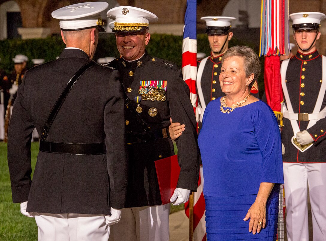 Lieutenant Gen. John E. Wissler, outgoing commander of Marine Corps Forces Command, and his wife Susan Wissler, receive awards during a retirement ceremony for Lt. Gen. Wissler at Marine Barracks Washington D.C., Sept. 22, 2017. Before Marine Corps Forces Command, Wissler served as commanding general of III Marine Expeditionary Force. He is retiring after 39 dedicated years of service to the Corps. (Official Marine Corps photo by Cpl. Robert Knapp/Released)
