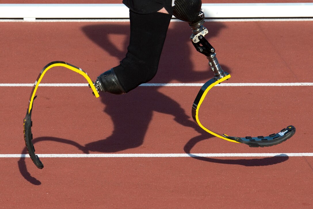 Army veteran Stefan LeRoy’s shadow is seen during the start of the 1500 meter race finals.