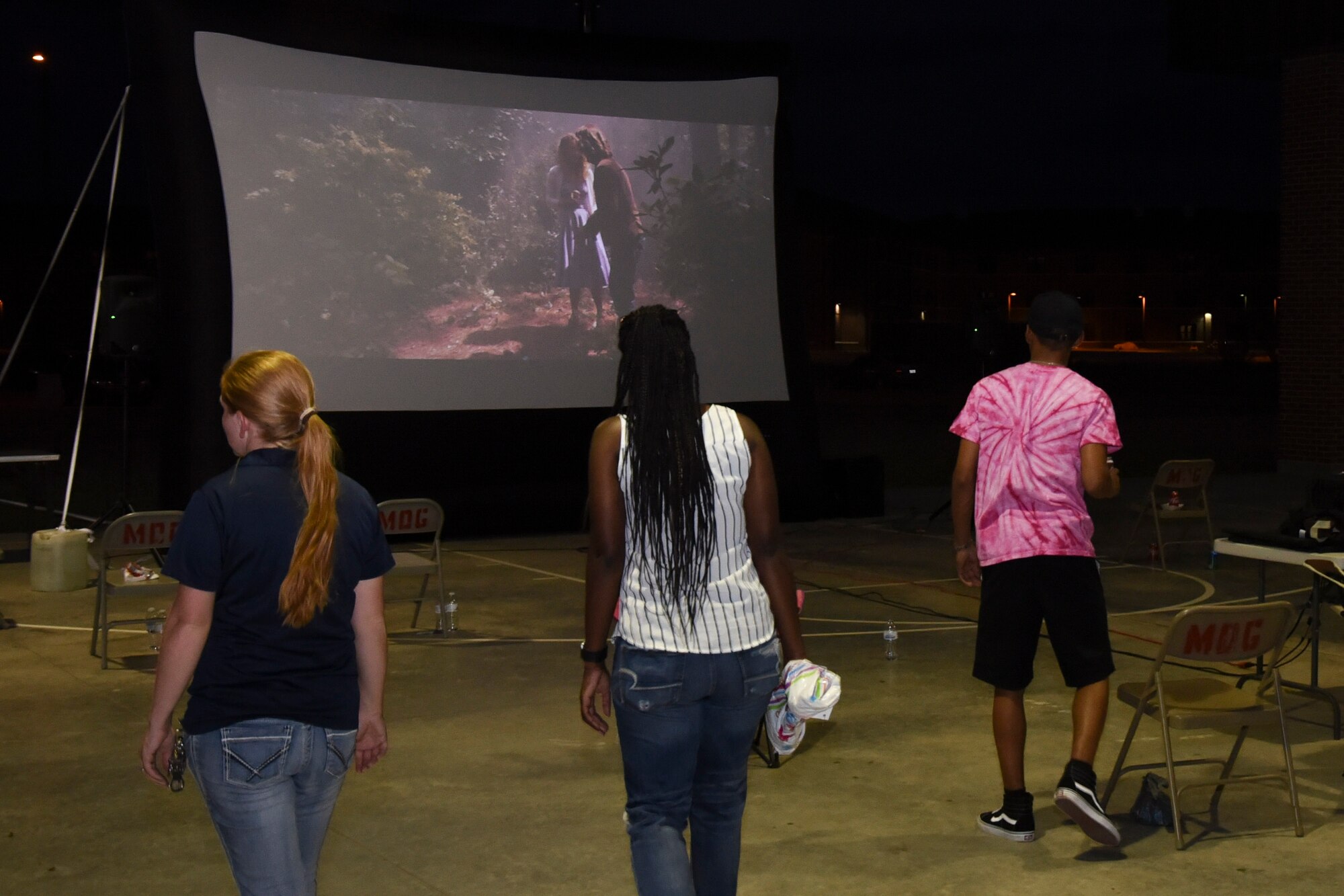 The event to dye for concludes with a showing of Guardians of the Galaxy 2 projected onto a blow up screen at the marching pad on Goodfellow Air Force Base, Texas, Sept. 22, 2017. The showing was an open air theater allowing individuals to bring blankets and their own chairs to watch on. (U.S. Air Force photo by Airman Zachary Chapman/Released)