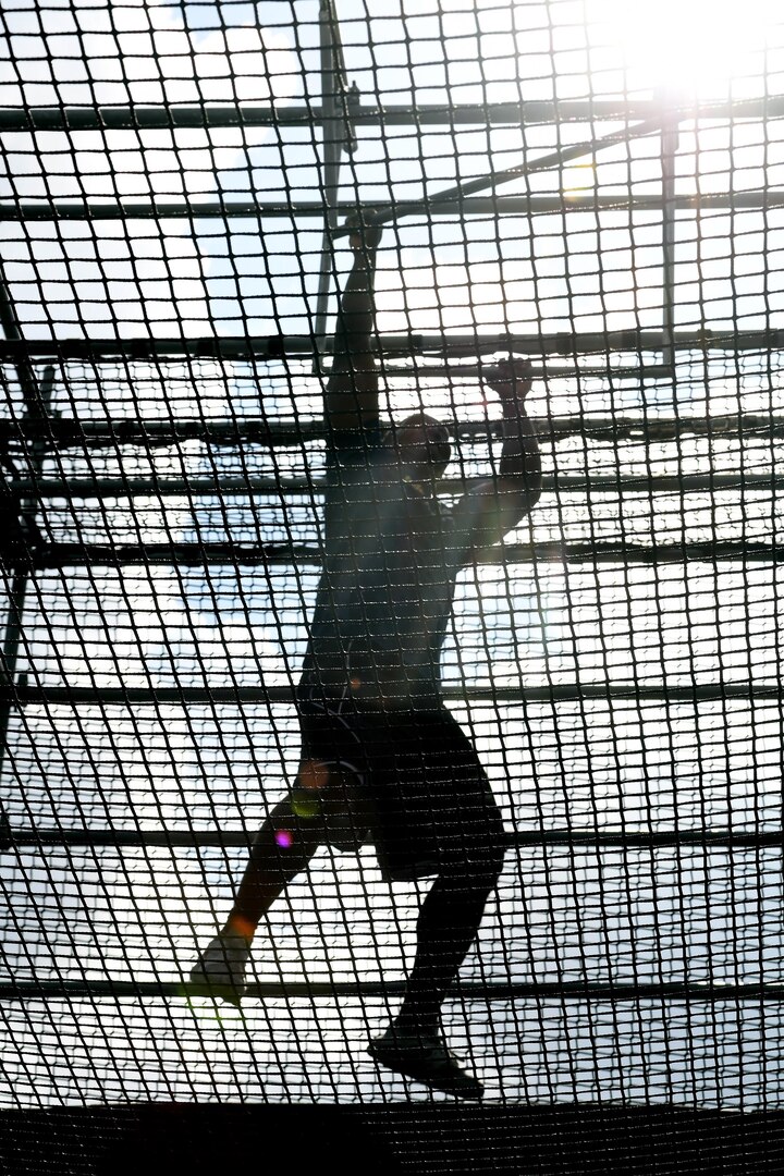 Spc. Richard Woods of Fort Bliss, Texas, attacks the final obstacle of the Alpha Warrior obstacle course at Retama Park in Selma, Texas, during the 2017 BOSS Strong Championship finale on Sept. 24.