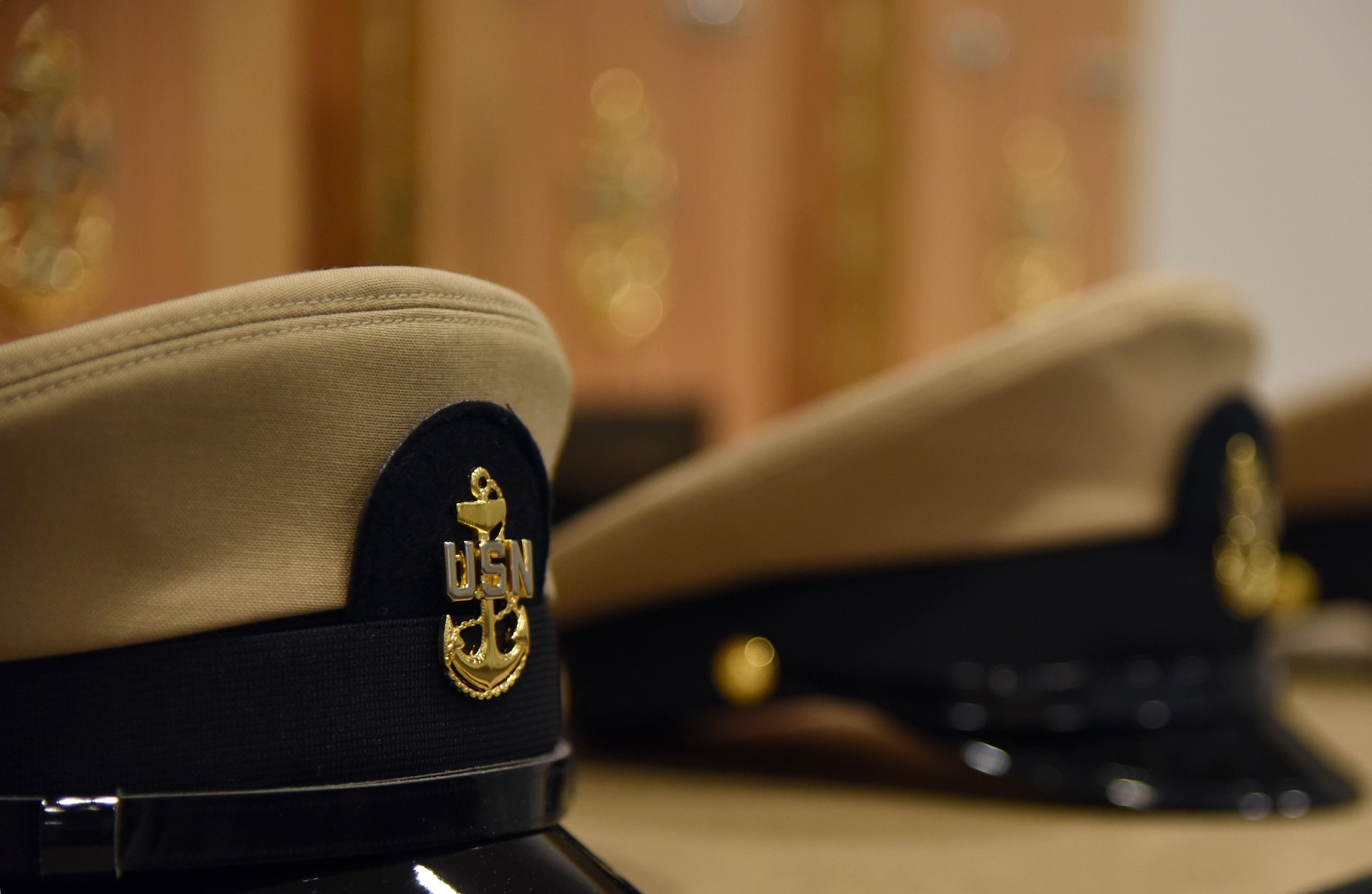 A U.S. Navy hat is on display during a Center for Naval Aviation Technical Training Unit Keesler Chief Petty Officer Pinning Ceremony at the Roberts Consolidated Aircraft Maintenance Facility Sept. 15, 2017, on Keesler Air Force Base, Mississippi. The six-week long Navy Chief Petty Officer Courses held at Keesler and the Naval Construction Battalion Center in Gulfport, Mississippi included four Air Force members, which is the first time Keesler Air Force members have gone through this process. The course is meant to enhance leadership skills and to strengthen the Navy-Air Force enlisted leadership relationship on Keesler. (U.S. Air Force photo by Kemberly Groue)