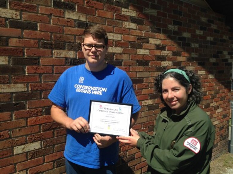 Brady Shrader was recognized by the staff of R.D. Bailey for his contributions as an Student Conservation Association (SCA) intern during the summer of 2017. Ranger Katy Smith presents Brady with a Certificate of Appreciation