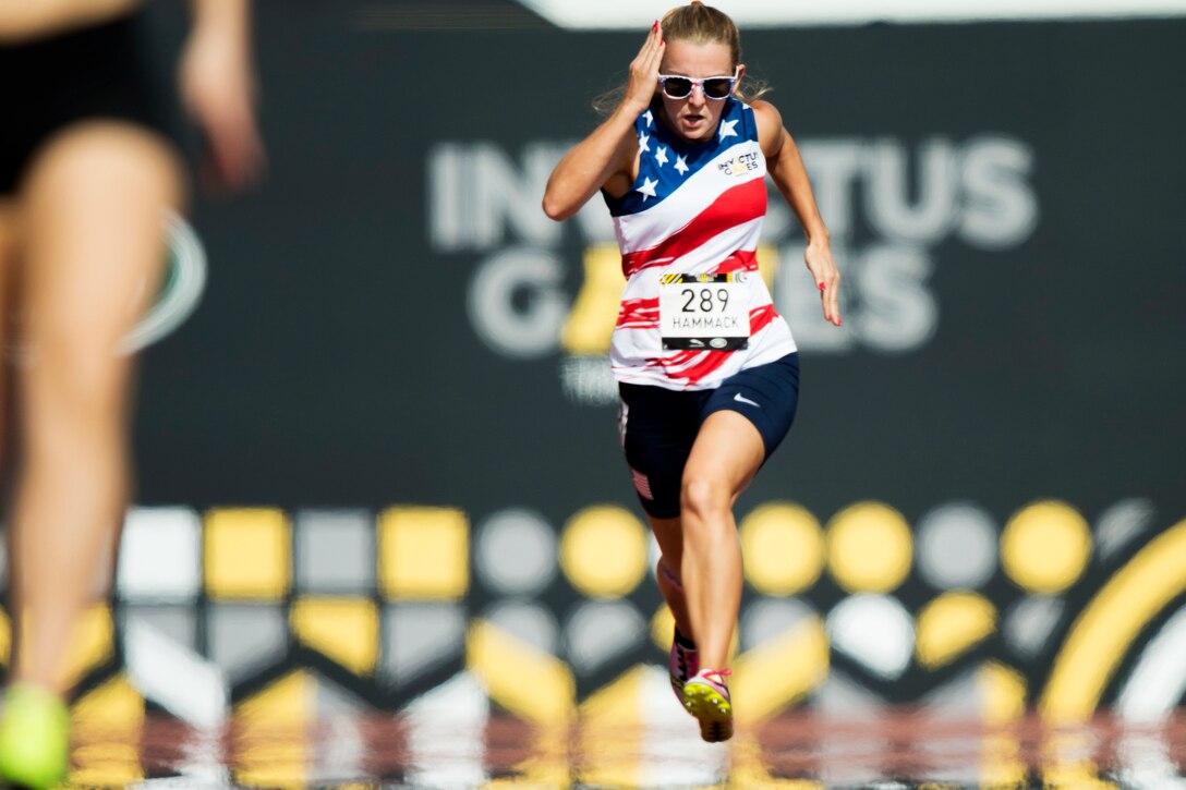 Marine Corps Cpl. Jessica Hammack sprints to the finish of the women's 200 meter dash.