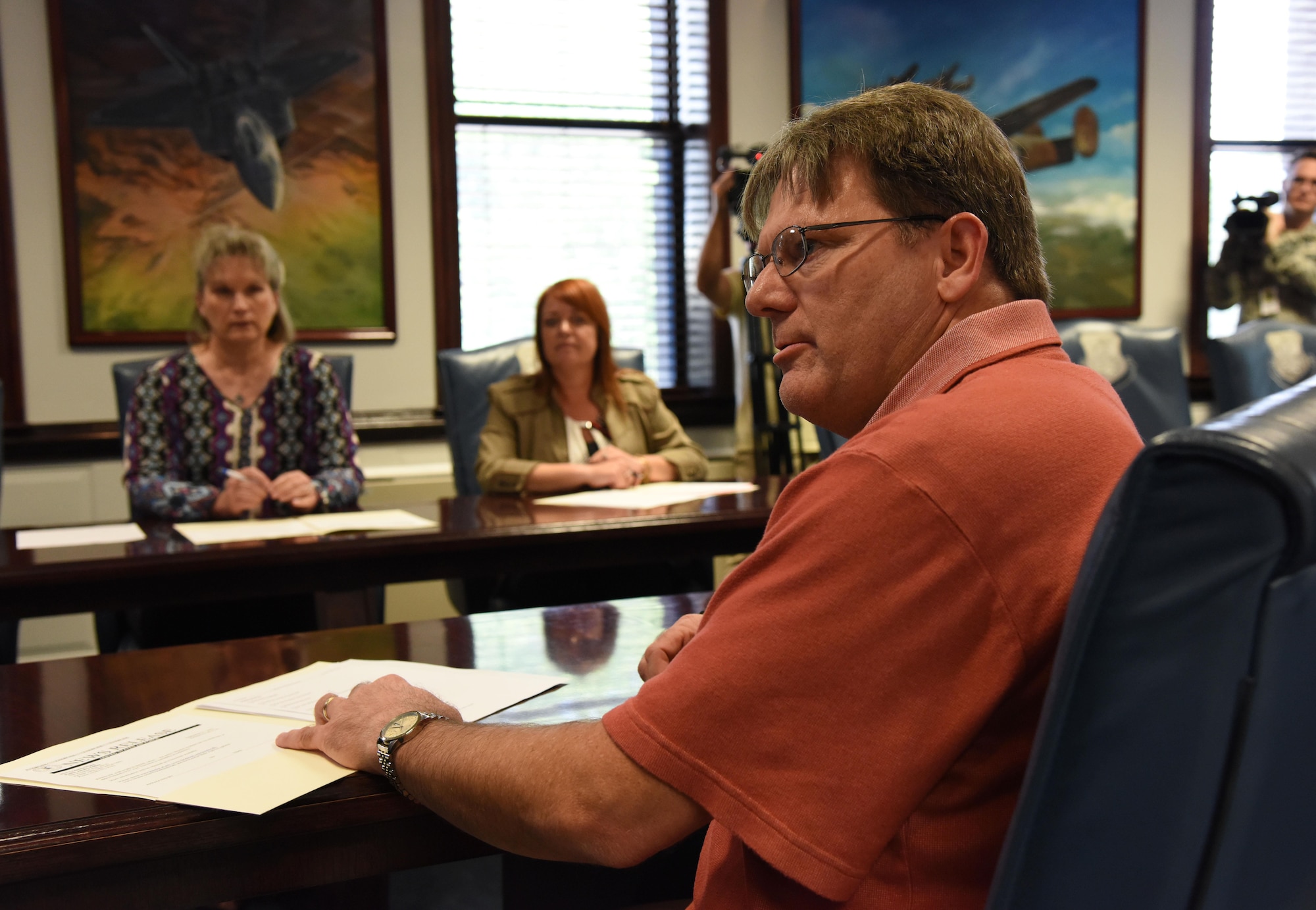 Kenneth Dodd, 81st Training Wing historian, portrays a reporter asking questions during a mock press conference during an active shooter exercise at the 81st TRW headquarters building Sept. 21, 2017, on Keesler Air Force Base, Mississippi. An active duty Air Force member simulated opening fire at the Arnold Medical Annex and the Larcher Chapel in order to test the base's ability to respond to and recover from a mass casualty event. (U.S. Air Force photo by Kemberly Groue)