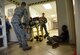 Members of the 81st Medical Group retrieve actors portraying victims from the scene during an active shooter exercise at the Arnold Medical Annex Sept. 21, 2017, on Keesler Air Force Base, Mississippi. An active duty Air Force member simulated opening fire at the Arnold Medical Annex and the Larcher Chapel in order to test the base's ability to respond to and recover from a mass casualty event. (U.S. Air Force photo by Kemberly Groue)