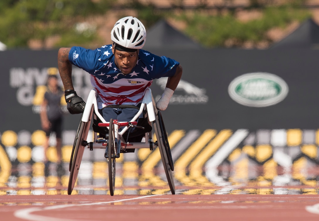 Marine Corps veteran Sgt. Anthony McDaniel competes in a wheelchair race during the finals of track and field.