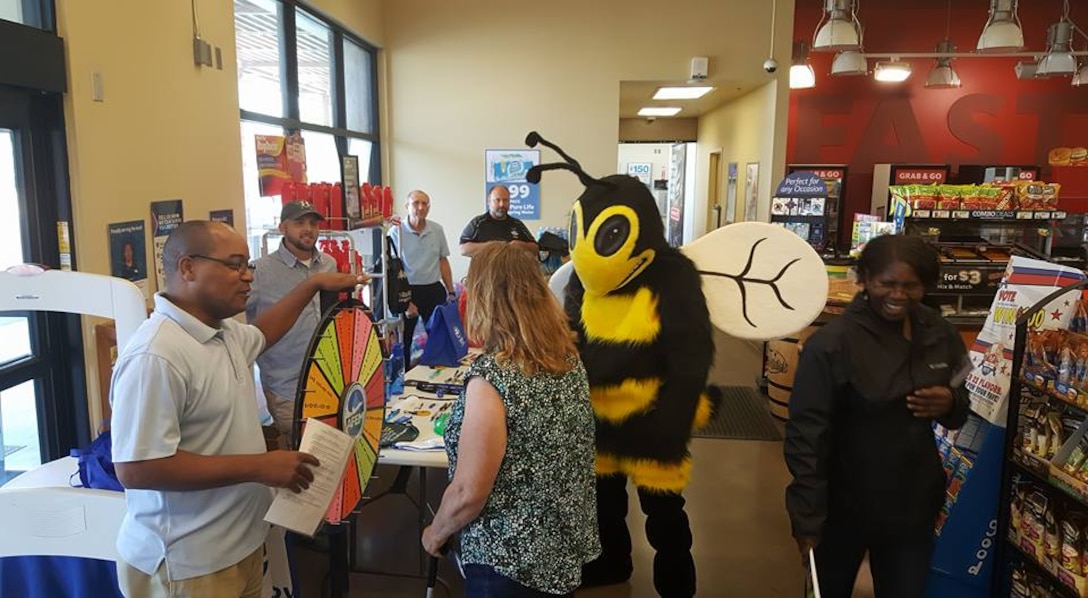 Eddie Bee Ready makes a visit to the Exchange Express gas station Sept. 22 as part of National Preparedness Month. Members of the 812th Civil Engineer Squadron Emergency Management Flight regularly dress up as the readiness mascot, including David Babcock who recently won the individual category of the Department of Defense’s 2016 National Preparedness Awards. (Courtesy photo)