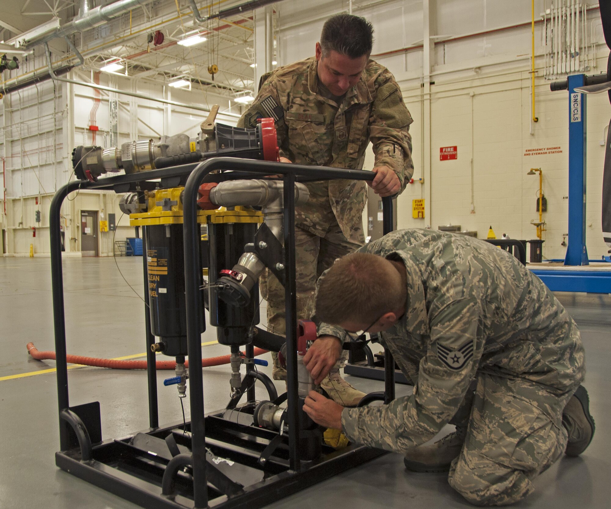 Maintainers from the 919th and 592nd Special Operations Maintenance Squadrons inspect an FB-014 fuel filter/water separator