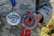 Staff Sgt. Teresa Monteon, 60th Medical Group training manager from San Jose, Calif., displays some of her Reebok Spartan Race medals outside David Grant USAF Medical Center at Travis Air Force Base, Calif., Sept. 22. After a five month battle with cancer, Monteon completed three Spartan races. She plans on running her fourth Spartan race on Sept. 30 in Olympic Valley, Calif. (U.S. Air Force photo by Tech. Sgt. James Hodgman)