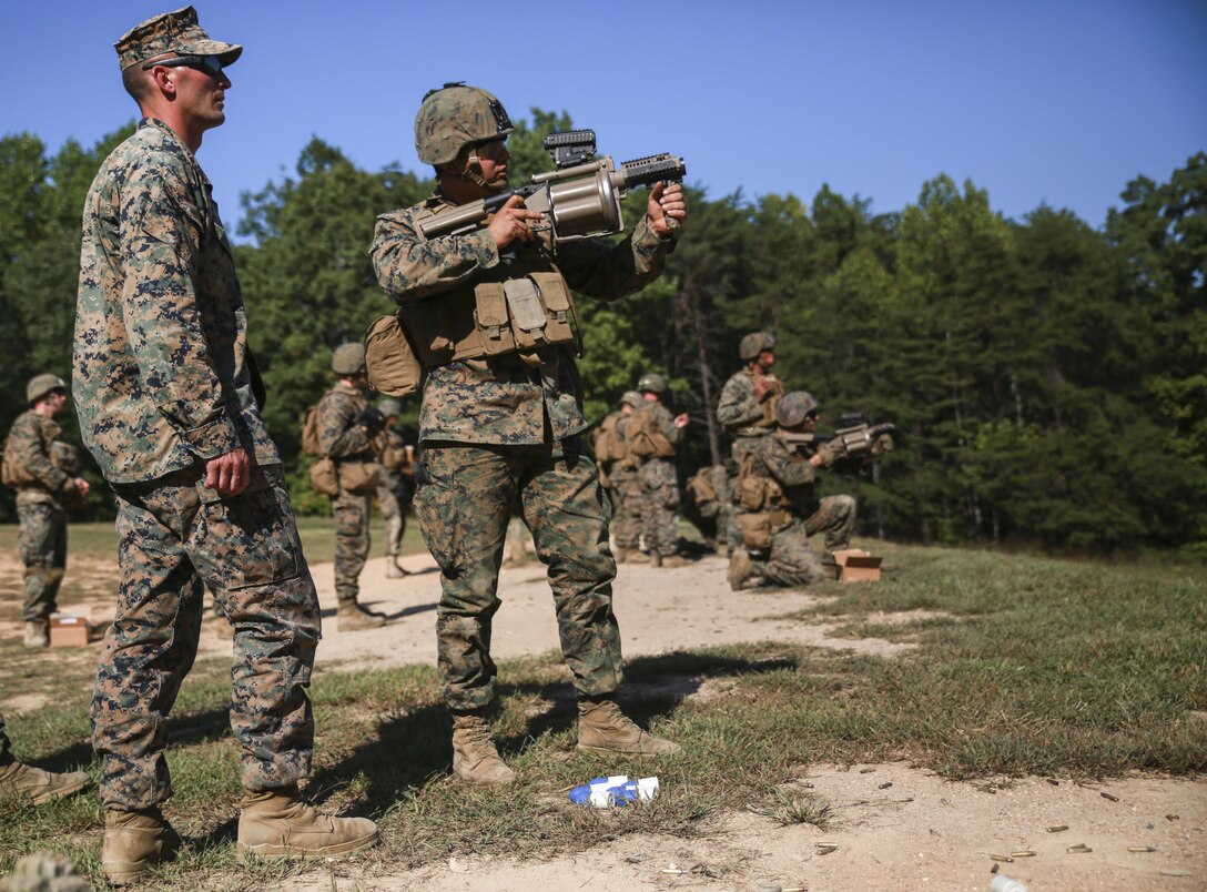 Staff Sergeant James M. Finney, platoon sergeant, 1st platoon, Alpha Company, Marine Barracks Washington D.C. oversees Marines as they fire simulation rounds from an M32 grenade launcher during Fire Team Leaders Course at Marine Corps Base Quantico, Va., Sept. 20, 2017. This is the third iteration of the course which is designed to refine the Marines’ infantry skills and strengthen their small unit leadership to prepare them for the fleet. (Official Marine Corps photo by Lance Cpl. Damon Mclean/Released)