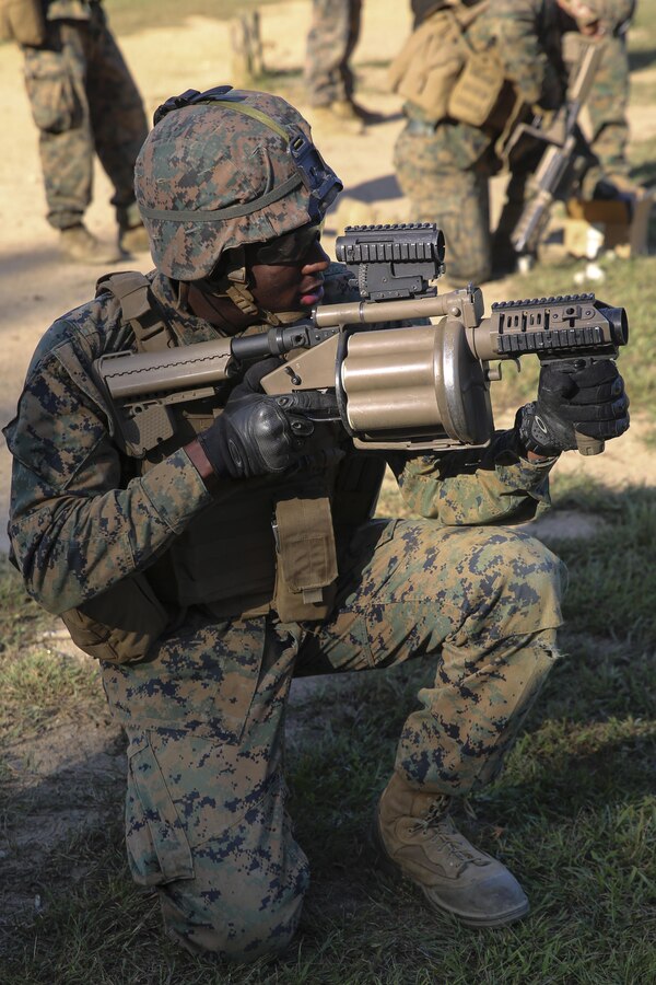 Lance Cpl. Deanthoney L. Buckles, 1st platoon, Bravo Company, Marine Barracks Washington D.C. fires rounds from an M32 grenade launchers during Fire Team Leaders Course at Marine Corps Base Quantico, Va., Sept. 20, 2017. This is the third iteration of the course which is designed to refine the Marines’ infantry skills and strengthen their small unit leadership to prepare them for the fleet. (Official Marine Corps photo by Lance Cpl. Damon Mclean/Released)