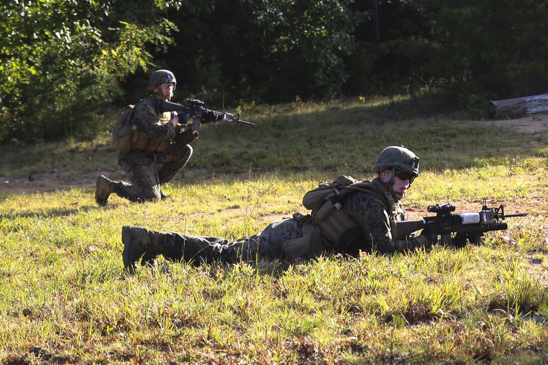 Sergeant Jared G. Brown, squad leader, Bravo Company, Marine Barracks Washington D.C.  coaches Marines during a live-fire training exercise for the Fire Team Leaders Course at Marine Corps Base Quantico, Quantico, Va., Sept. 20, 2017. This is the third iteration of the course which is designed to refine the Marines’ infantry skills and strengthen their small unit leadership to prepare them for the fleet. (Official Marine Corps photo by Lance Cpl. Damon Mclean/Released)