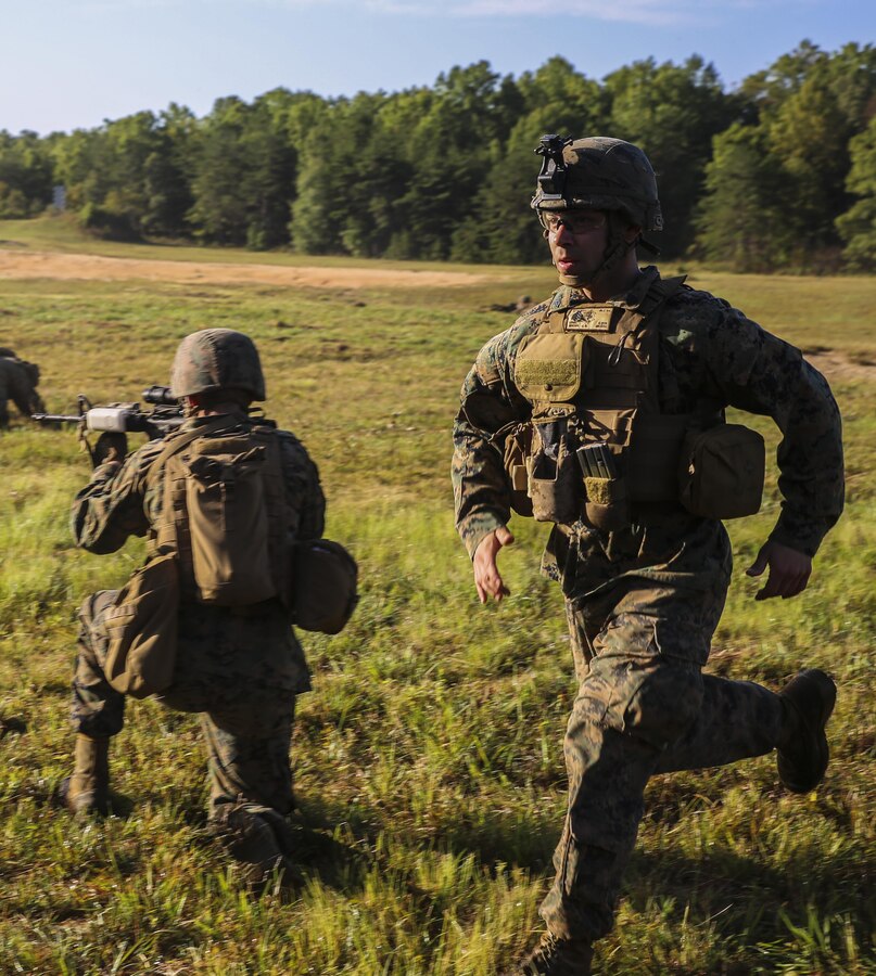 Sergeant Jared G. Brown, squad leader, Bravo Company, Marine Barracks Washington D.C. coaches Marines during a live-fire training exercise for the Fire Team Leaders Course at Marine Corps Base Quantico, Va., Sept. 20, 2017. This is the third iteration of the course which is designed to refine the Marines’ infantry skills and strengthen their small unit leadership to prepare them for the fleet. (Official Marine Corps photo by Lance Cpl. Damon Mclean/Released)