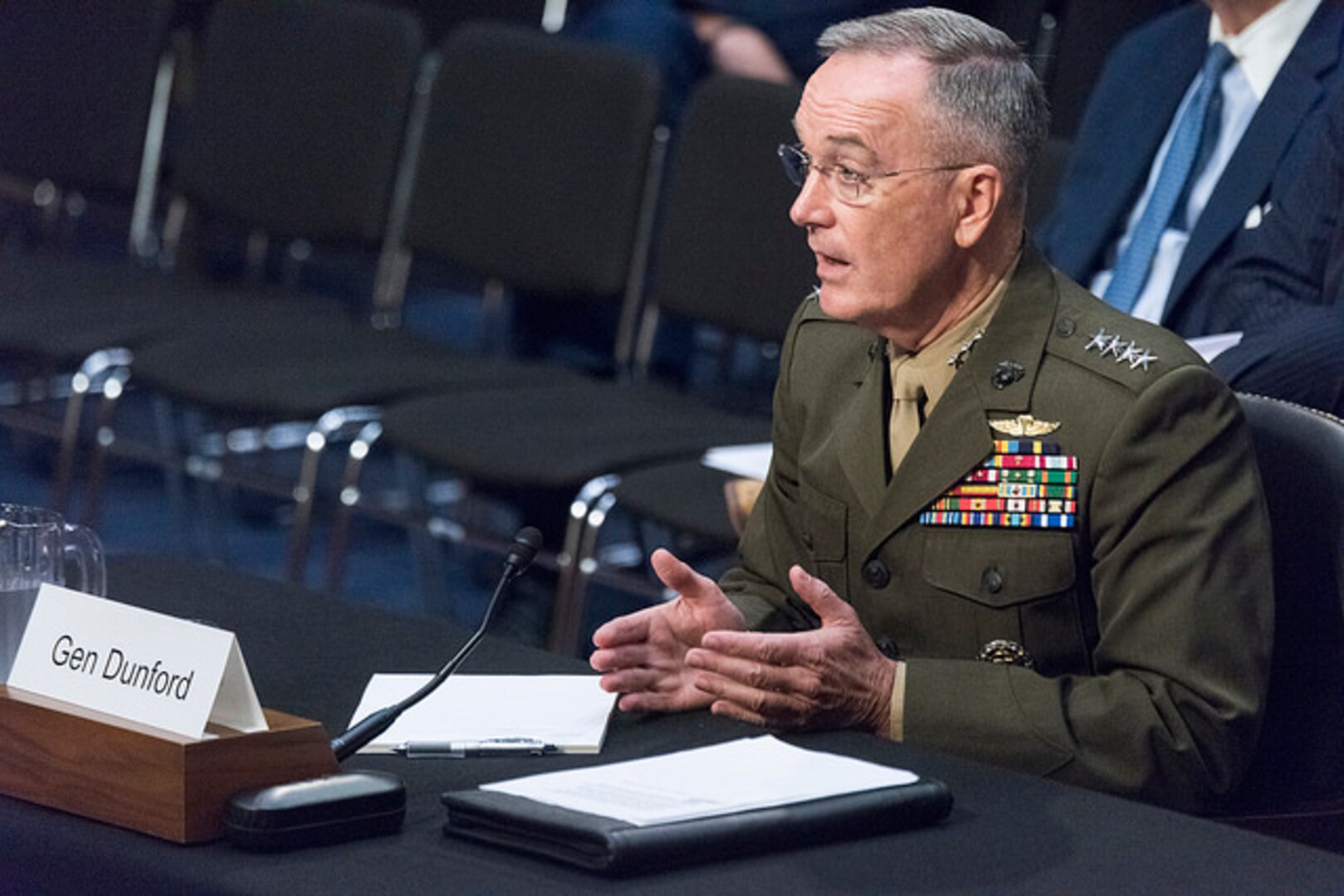 Marine Corps Gen. Joe Dunford, chairman of the Joint Chiefs of Staff, waits to be seated during the Senate Armed Services Committee reconfirmation hearing.