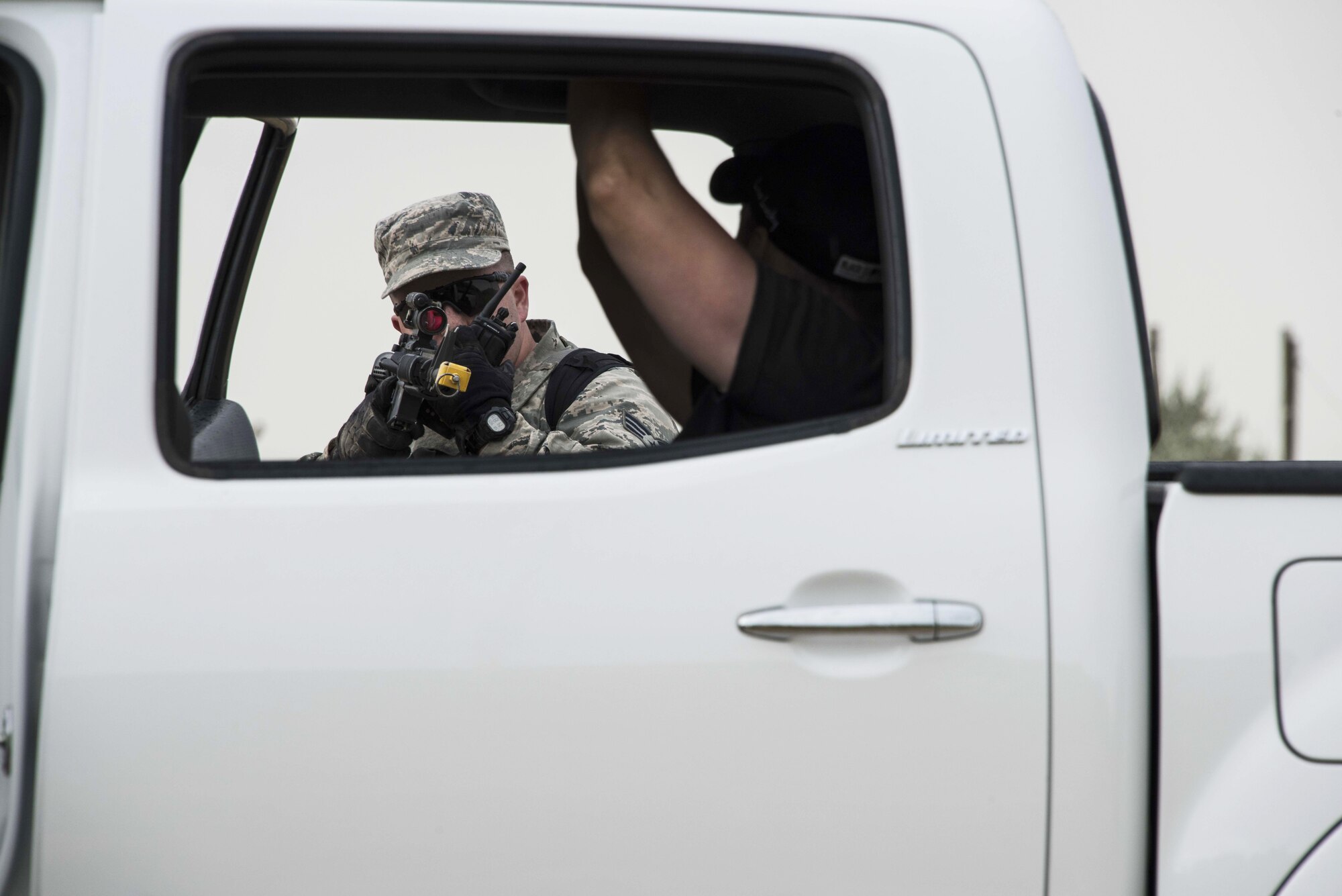 Senior Airman Matthew Parker, a fire team member in the 419th Security Forces Squadron, challenges a vehicle at the entry control point during a training exercise at Hill Air Force Base, Utah, Sept. 9.