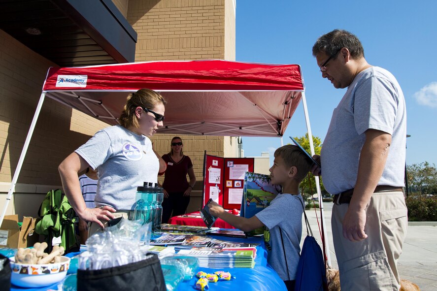 Master Sgt. Terri Adams, 23d Civil Engineer Squadron emergency management section chief, left, talks to the Uyeno family at a local pet store, Sept. 23, 2017, in Valdosta, Ga. Members of the 23d CES hosted the event as part of National Preparedness Month to educate pet owners on disaster precautions. (U.S. Air Force photo by Airman 1st Class Erick Requadt)