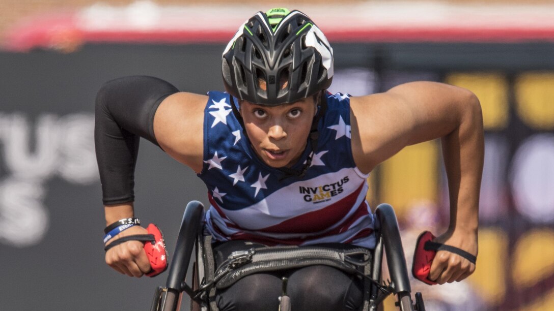 A Marine Corp veteran races in a wheelchair.