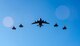A C-17 Globemaster III and four F-22 Raptors fly in formation over Joint Base Pearl Harbor-Hickam, HI, Sept. 26, 2017.
