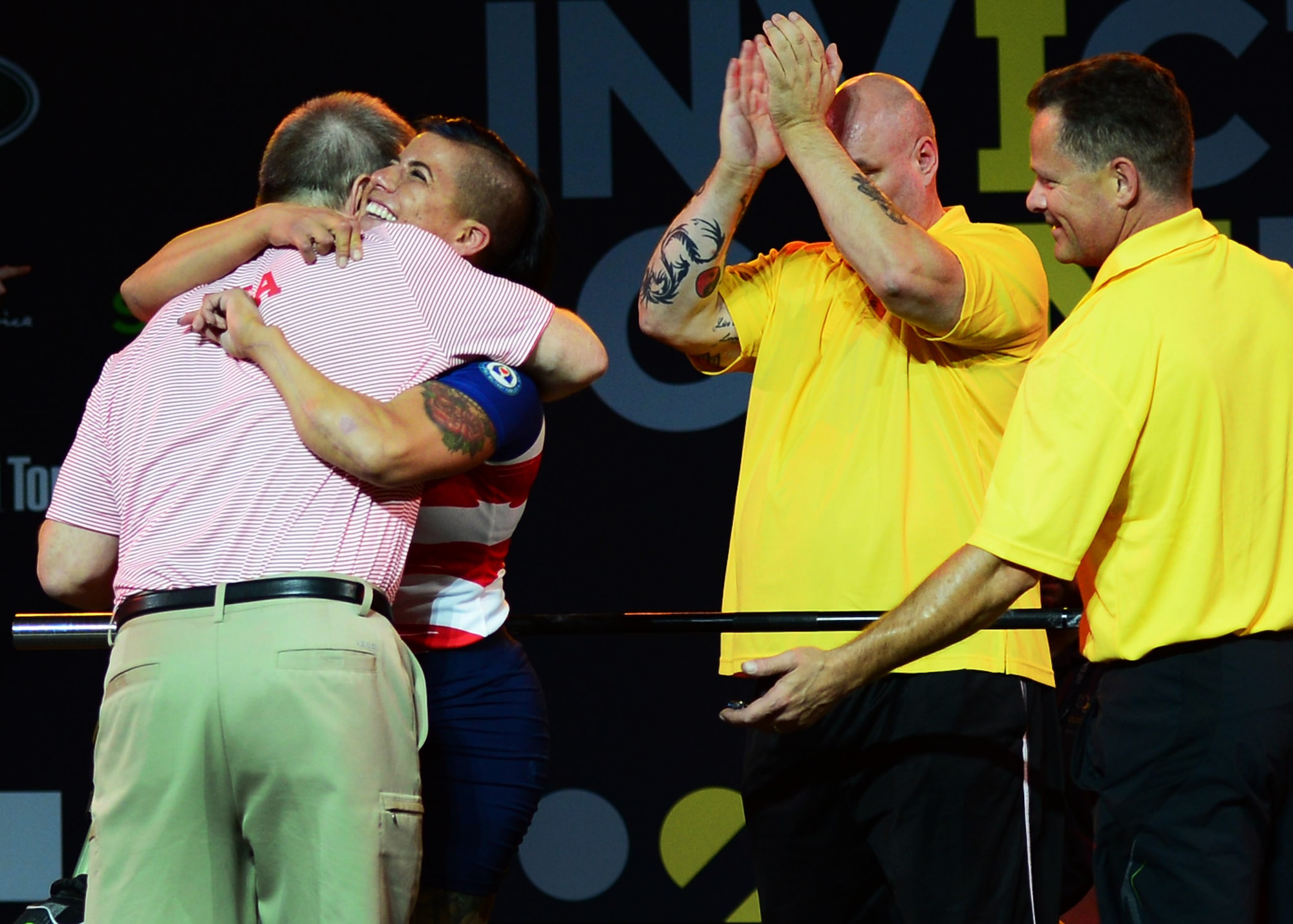 Air Force veteran Sebastiana Lopez, a former C-17 crew chief staff sergeant and member of Team U.S., hugs one of her coaches following a successful lift during the women’s lightweight powerlifting competition at the Mattamy Sports Centre in Toronto, Canada, Sept. 25, 2017. This is Lopez’s second year competing in the Invictus Games. (U.S. Air Force photo by Staff Sgt. Chip Pons)