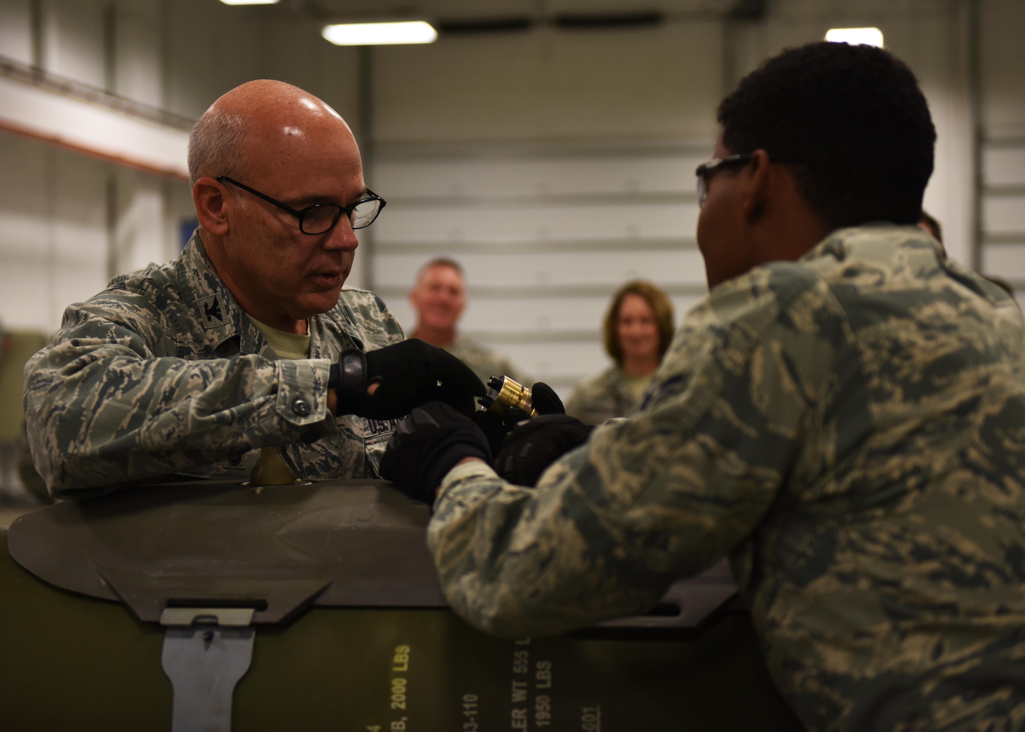 Col. Patrick Matthews, Eighth Air Force vice commander, builds an inert conventional bomb during a tour at Minot Air Force Base, N.D., Sept. 25, 2017. During the tour, Matthews visited the 5th Munitions Squadron, Combat Arms Training and Maintenance, Explosive Ordnance Disposal, Military Working Dogs, 23rd Aircraft Maintenance Unit, and the 5th Operations Support Squadron alert facility.(U.S. Air Force photo by Airman 1st Class Alyssa M. Akers)