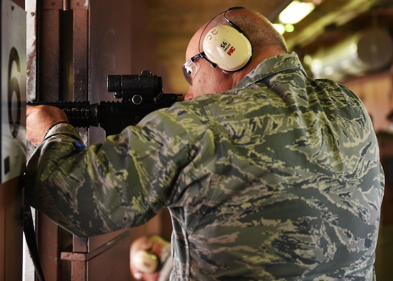 Col. Patrick Matthews, Eighth Air Force vice commander, fires an M4 carbine during a tour at Minot Air Force Base, N.D., Sept. 25, 2017. During the tour, Matthews visited the 5th Munitions Squadron, Combat Arms Training and Maintenance, Explosive Ordnance Disposal, Military Working Dogs, 23rd Aircraft Maintenance Unit, and the 5th Operations Support Squadron alert facility.(U.S. Air Force photo by Airman 1st Class Alyssa M. Akers)
