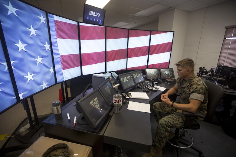 Lance Cpl. Dustin Hesse, an air traffic controller trainee with Marine Corps Air Station (MCAS) Kaneohe Bay, prepares to operate a training simulator at the air traffic control tower, MCAS Kaneohe Bay, Sept. 20, 2017. Air traffic controllers work to safely organize and regulate the flow of air traffic, and prevent collisions between aircraft. (U.S. Marine Corps photo by Lance Cpl. Isabelo Tabanguil)